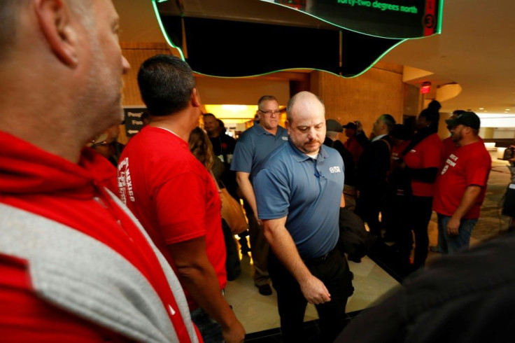 Members attending the UAW GM Council Meeting walk through a gauntlet of GM employees from the shuttered Lordstown Assembly as they arrive at the General Motors Renaissance Center in Detroit, Michigan, on October 17, 2019