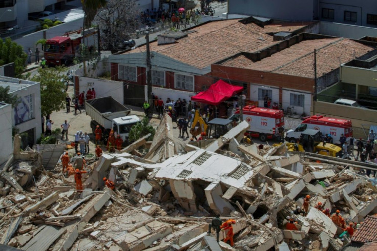 Firefighters search for survivors after a seven-story residential building collapsed in Fortaleza, Brazil, on October 15, 2019