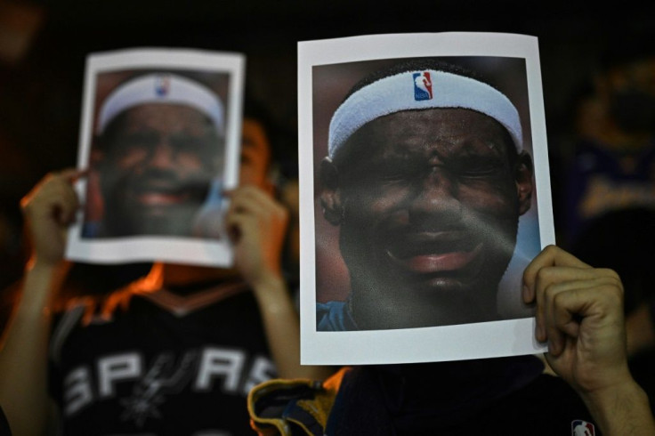 Protesters in Hong Kong hold photos of NBA star LeBron James as the fallout continues from a tweet last month by an NBA team executive supportive of pro-democracy protesters in Hong Kong, an executive James said needed to be better informed on the issue