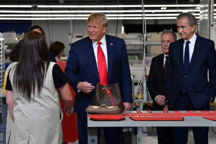 Chief Executive of LVMH Bernard Arnault (R), CEO of Louis Vuitton Michael Burke (C) and US President Donald Trump visit the new Louis Vuitton factory in Alvarado Texas, October 17, 2019