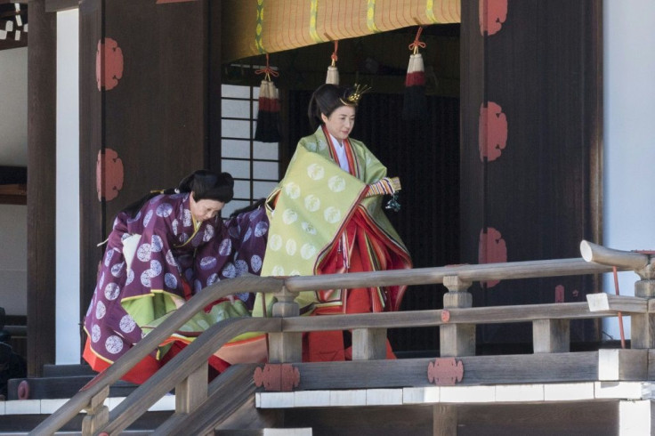 Empress Masako's multi-layered kimono will be so heavy that it will be hard for her to move