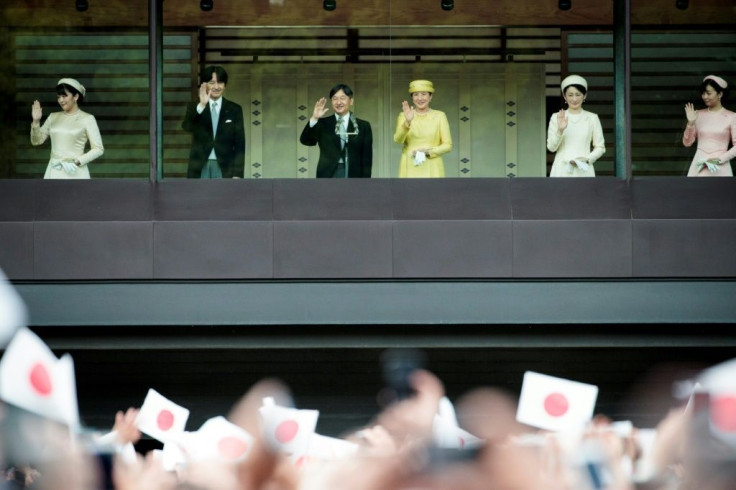 A public parade for the royal couple has been postponed after a devastating typhoon in Japan
