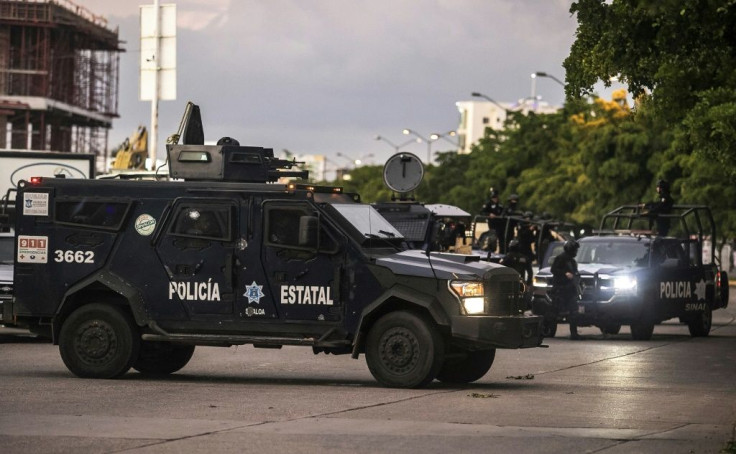 Mexican police patrol in Culiacan after heavily armed gunmen fought an intense battle with security forces