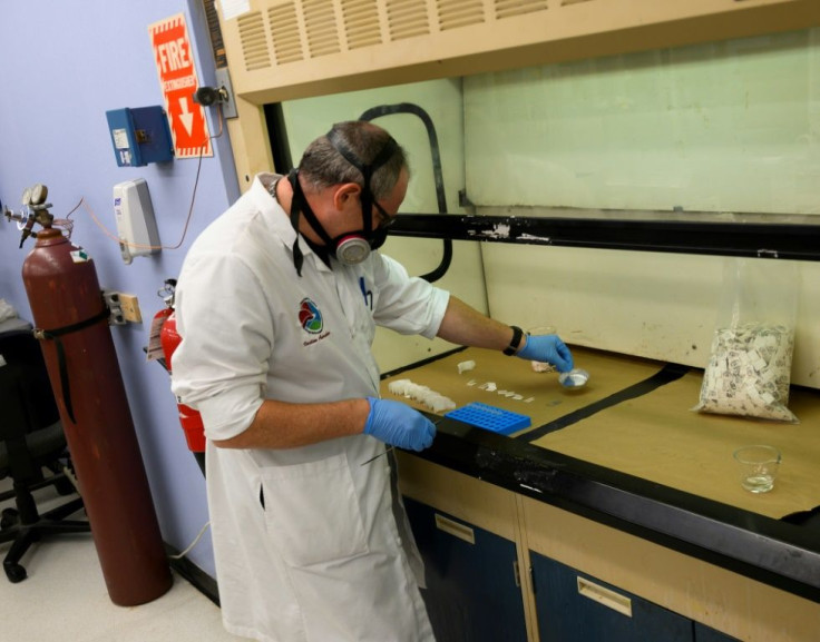 A Drug Enforcement Administration (DEA) chemist checks confiscated powder containing fentanyl at the DEA Northeast Regional Laboratory in New York