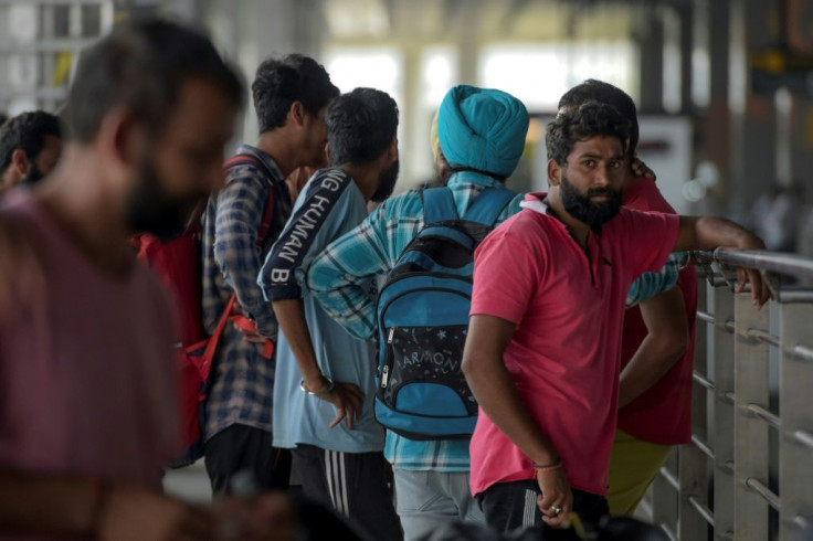 Indian nationals arrive at Indira Gandhi International airport after being deported from Mexico