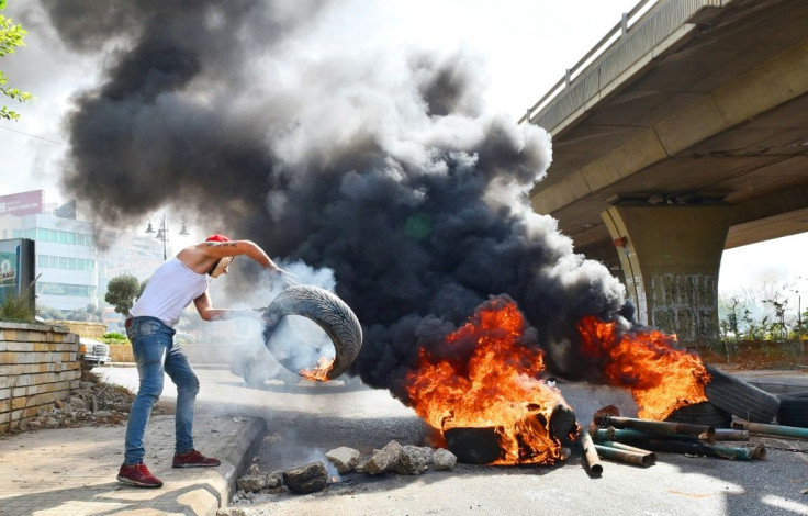 Demonstrators blocked roads near Lebanon's main airport with burning tyres