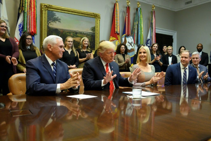 US President Donald Trump (C), Vice President Mike Pence (L), Advisor to the President Ivanka Trump (3rd R) and NASA Administrator Jim Bridenstine (2nd R) speak to NASA astronauts Christina Koch and Jessica Meir during the first all-woman spacewalk