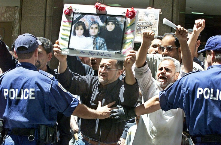 Families of those killed in the disaster protested in 2001 against Australia's hardline asylum-seeker policies