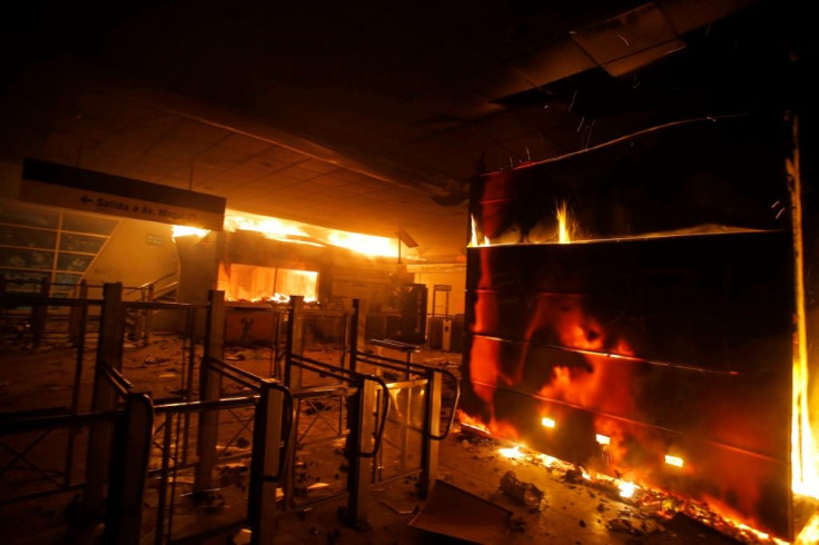 Dozens of Santiago metro stations were torched, forcing the closure of the entire subway network