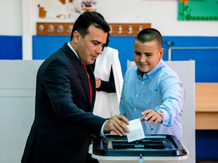 Prime Minister Zoran Zaev and his son Dushko cast their ballot for a referendum to re-name their country North Macedonia on September 30, 2018