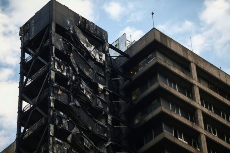View of the Chilean electric company ENEL's building, after being burned during a mass protests on October 18, 2019 in Santiago