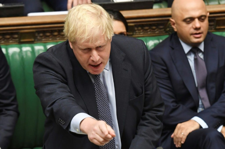 A handout picture released by the UK Parliament shows Britain's Prime Minister Boris Johnson making a statement in the House of Commons in London on October 19, 2019. British MPs voted to delay a decision on whether to approve Boris Johnson's Brexit deal