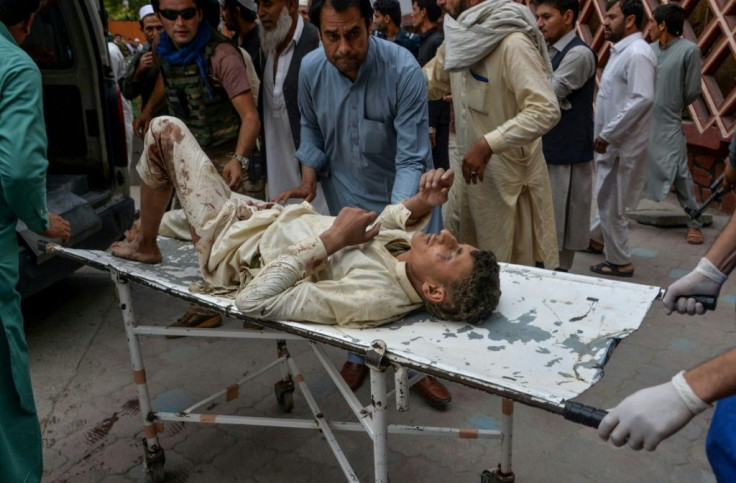 The deadly blast in Afghanistan's eastern province of Nangarhar also wounded at least 36 people, including this man being carried to hospital
