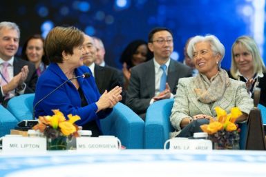 IMF chief Kristalina Georgieva applauds her predecessor Christine Lagarde, who will take over as head of the European Central Bank, in this image released by the International Monetary Fund