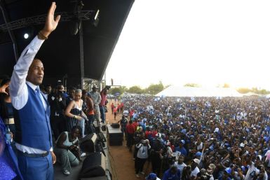 Umbrella for Democratic Change leader Duma Boko greets supporters at a rally in Gaborone Saturday