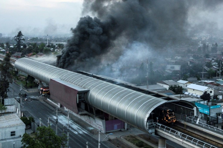 Aerial view of a metro station burned by protesters in Santiago on October 19, 2019