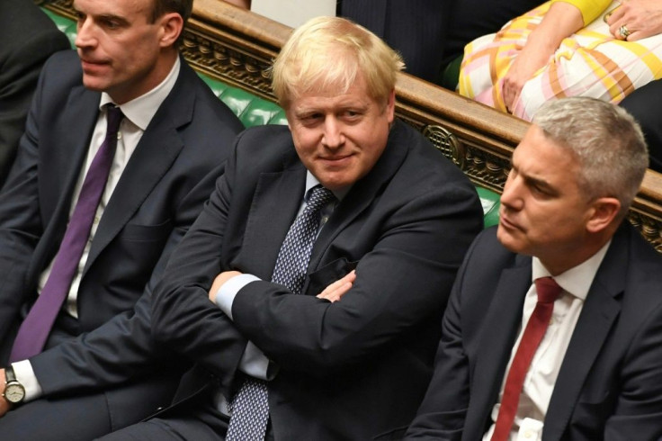 A defiant Boris Johnson (C) had earlier told MPs he would not negotiate a Brexit delay with the EU