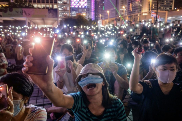 On Saturday night hundreds of mostly masked protesters held a prayer vigil in the commercial district