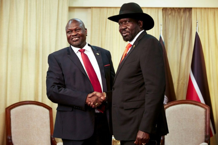 Handshake: South Sudan President Salva Kiir, right, with ex-vice president and former rebel leader Riek Machar, in Juba on Saturday
