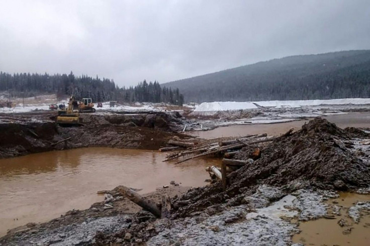 The dam's collapse unleashed a torrent of icy and muddy water, which engulfed the workers' huts