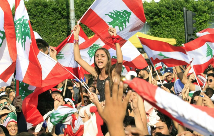 Protests took place across Lebanon, with demonstrators waving Lebanese flags in the crowd in the southern city of Sidon