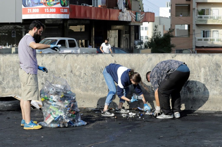 Volunteers cleaned the streets near the parliament in Beirut and along a highway linking the capital to north Lebanon after demonstrations on Saturday night