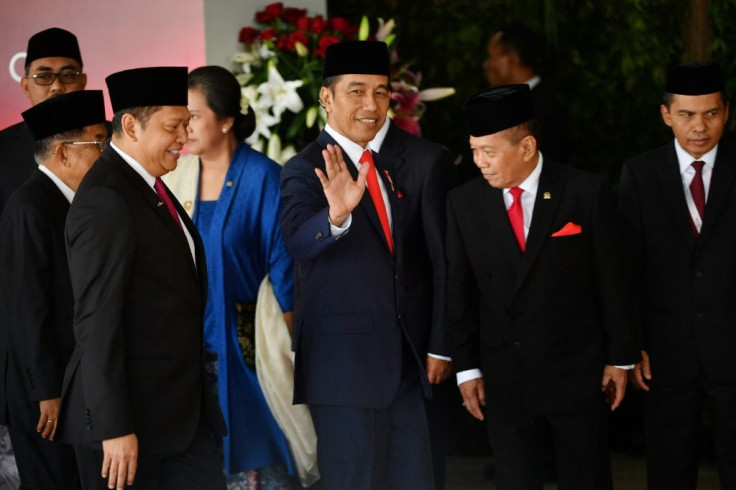 Indonesia's President Joko Widodo (C) said his final term would be aimed at eradicating poverty
