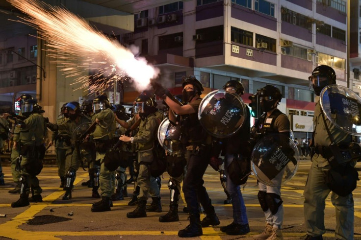 Hong Kong police fired repeated volleys of tear gas, rubber bullets and baton charges