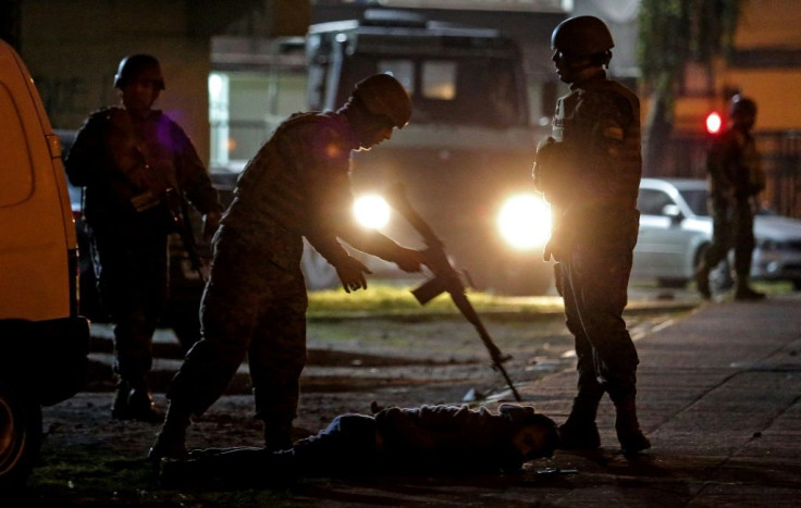 Soldiers arrest a demonstrator during protests in Concepcion, Chile, on October 20, 2019