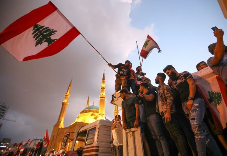 Hundreds of thousands of people have joined protests demanding a sweeping overhaul of Lebanon's political system
