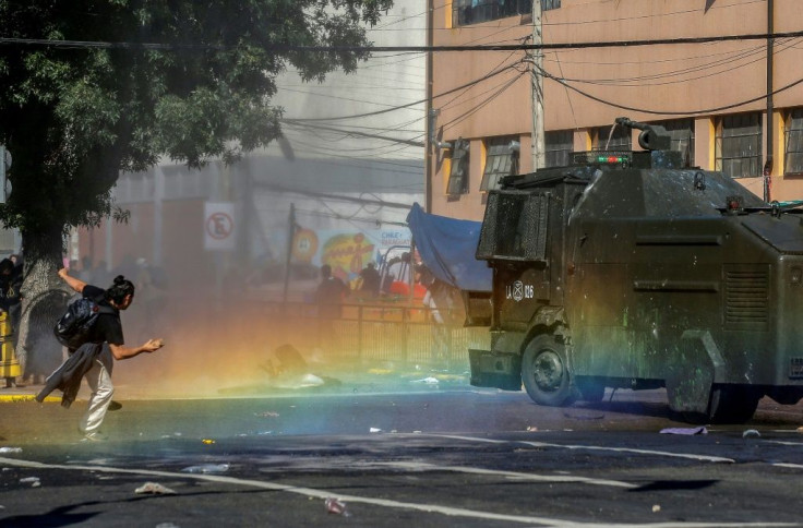 Clashes in Chile have seen police and military fire tear gas and water cannon against protesters