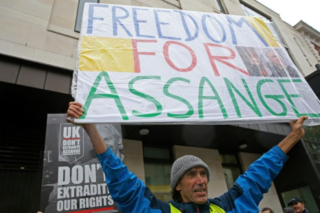 Around 50 gathered outside the court, chanting "free Julian Assange"