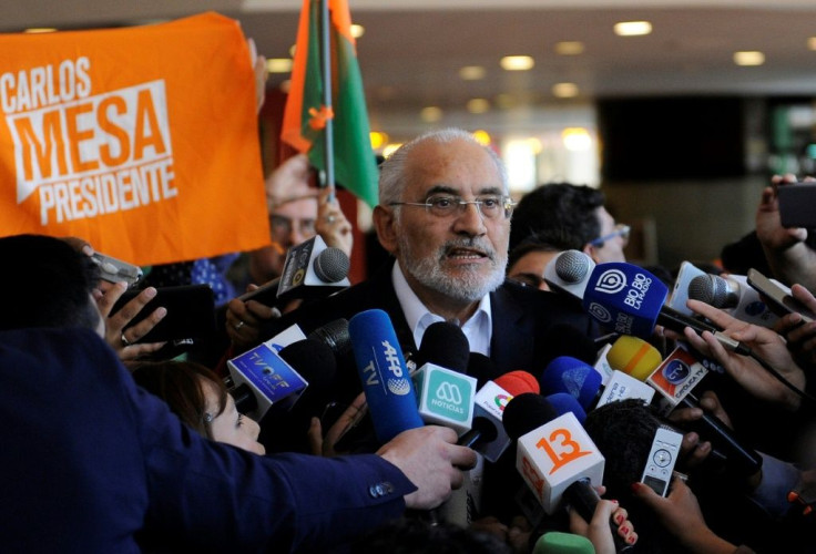 Boliviaâs opposition presidential candidate Carlos Mesa speaking to reporters in La Paz on Monday