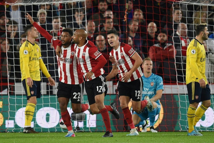 Sheffield United striker Lys Mousset (2nd L) celebrates the winner against Arsenal