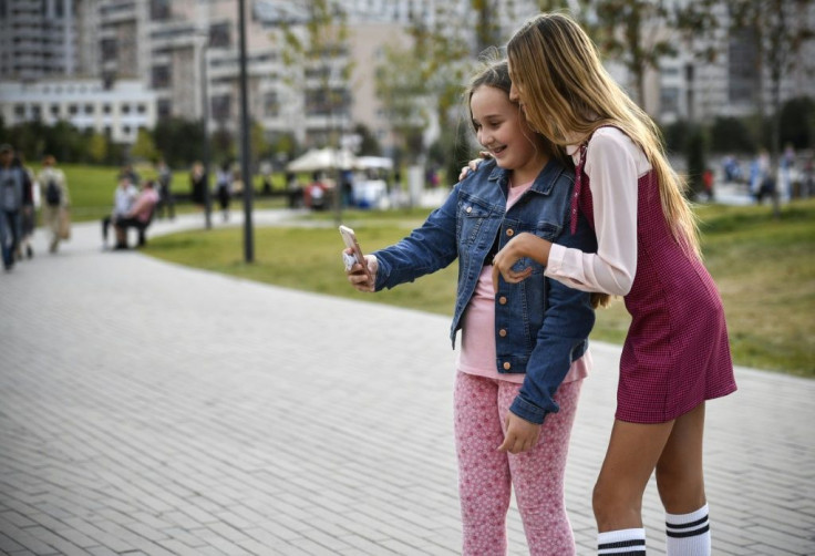 Fans, both girls and boys, come up to take selfies with Liza