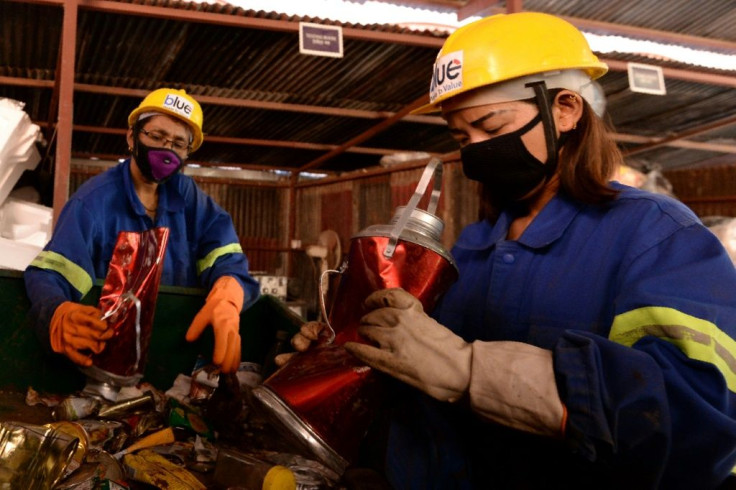 Workers there manually sorted the materials -- with discarded bottles re-fashioned into household items