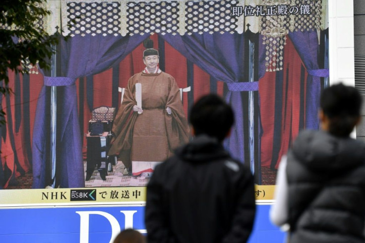 A public parade for the event was cancelled but people in Tokyo watched the proceedings on big screens in the city