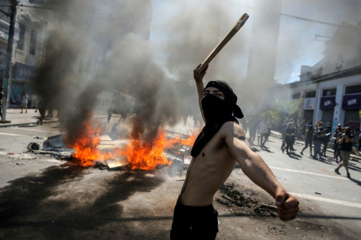 Protests originally against a hike in metro fares have turned into anger at the Chilean military and President Sebastian Pinera