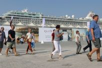 Tourists disembark at Doha Port as a new cruise season kicks off with the launch of a new temporary passenger terminal as Qatar works to increase the number of cruise ships making calls in the Gulf state