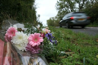 Tributes lie on the roadside near RAF Croughton in Northamptonshire, central England on October 10, 2019, at the spot where Harry Dunn was killed as he travelled along the B4031 on August 27