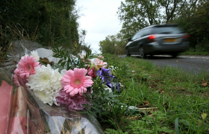 Tributes lie on the roadside near RAF Croughton in Northamptonshire, central England on October 10, 2019, at the spot where Harry Dunn was killed as he travelled along the B4031 on August 27