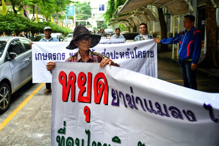 Representatives of Thai farmers arrive at the Ministry of Industry in Bangkok to support certain pesticides, but the National Hazardous Substances Committee voted to ban glyphosate and the chemicals paraquat and chlorpyrifos, officials said