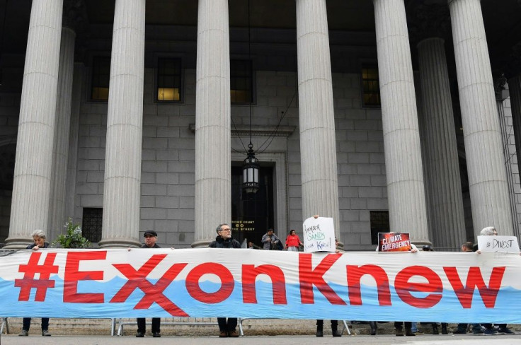 Climate activists protest on the first day of the ExxonMobil trial outside the New York State Supreme Court building