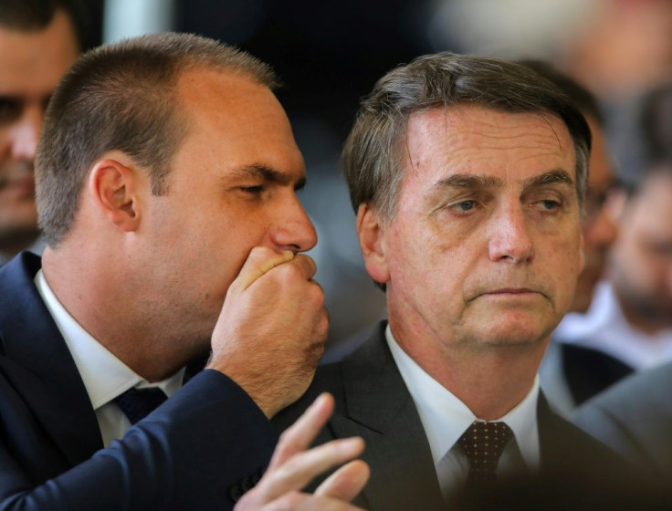 Eduardo Bolsonaro (L) presents a more polished image than his father the president, who often appears ill at ease in public