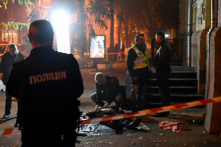 The blast left two men dead and a woman injured at the entrance to an office building in the centre of the capital Kiev