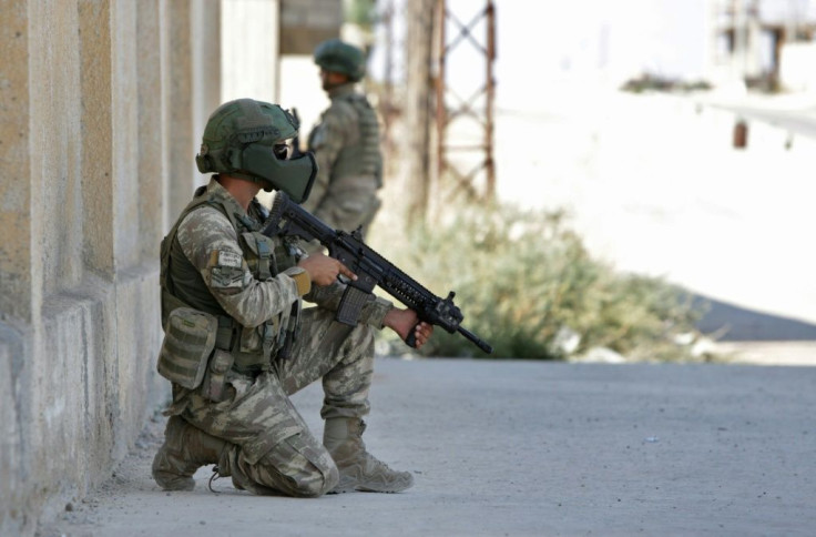 Turkish soldiers patrolled the town of Tal Abyad in northern Syria a day after the agreement between Moscow and Ankara