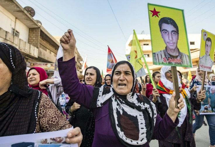 Syrian Kurds hold a protest in the town of Qamishli against the Turkish assault on northeastern Syria
