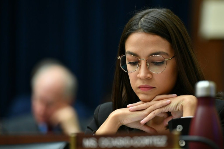 Rep. Alexandria Ocasio-Cortez listens as Facebook Chairman and CEO Mark Zuckerberg testifies before the House Financial Services Committee