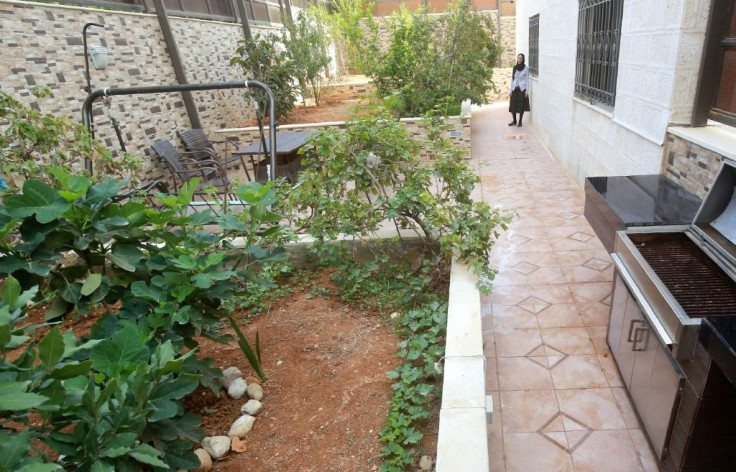 Manal Ibrahim, director of the "Dar Amneh" safe house for women threatened with violence, takes a walk in the shelter's garden in the Jordanian capital Amman, on October 22, 2019