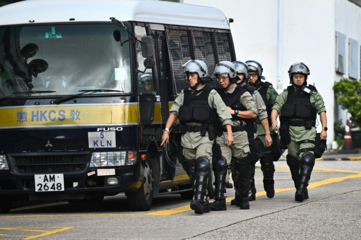 Correctional officers walk outside Pik Uk Prison in Hong Kong as Chan Tong-kai was set to be released from prison after serving a short jail sentence